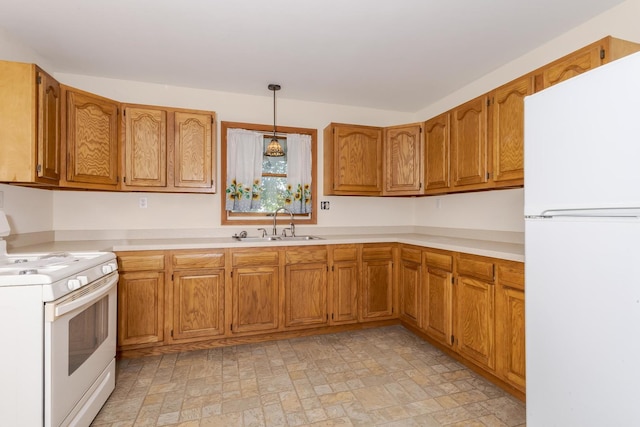 22998 E 2800 N Rd, Odell, IL 60460 - kitchen featuring white appliances, light countertops, brown cabinetry, and hanging light fixtures