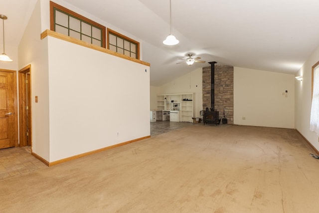 22998 E 2800 N Rd, Odell, IL 60460 - unfurnished living room with a wood stove, lofted ceiling, carpet flooring, and a ceiling fan