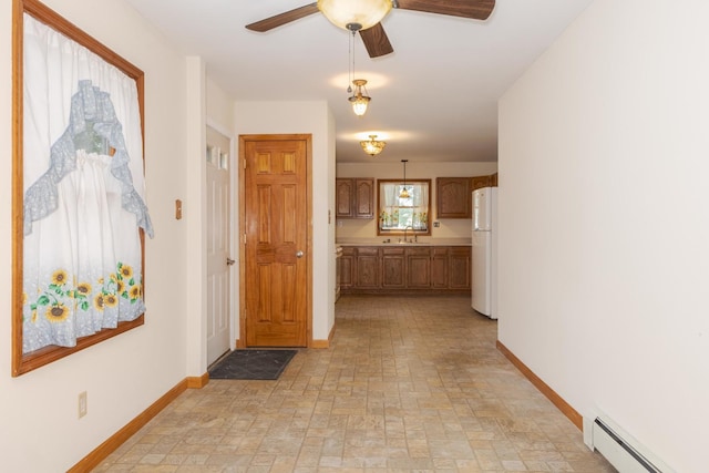 22998 E 2800 N Rd, Odell, IL 60460 - hallway with baseboard heating and baseboards