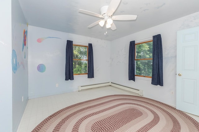 22998 E 2800 N Rd, Odell, IL 60460 - spare room featuring a baseboard heating unit and ceiling fan