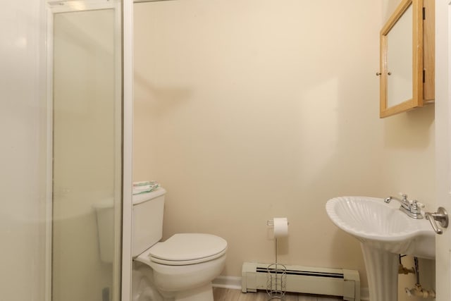22998 E 2800 N Rd, Odell, IL 60460 - bathroom featuring a baseboard heating unit and a shower with door