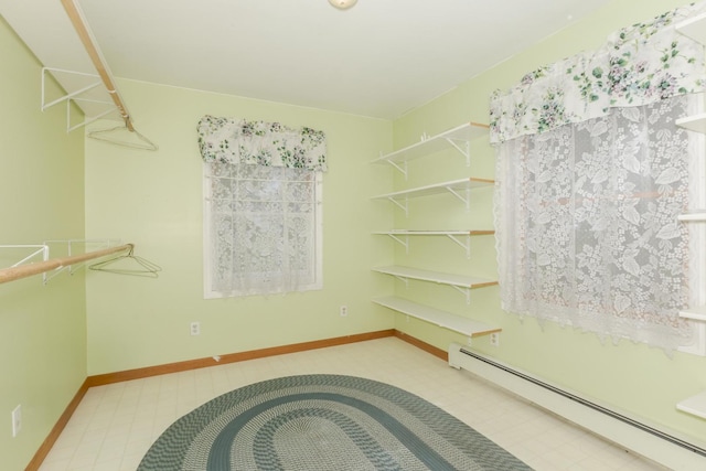 22998 E 2800 N Rd, Odell, IL 60460 - spacious closet featuring a baseboard radiator and tile patterned floors