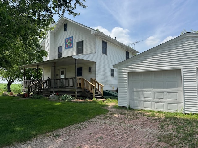 22998 E 2800 N Rd, Odell, IL 60460 - view of front facade with a garage, driveway, covered porch, and a front yard