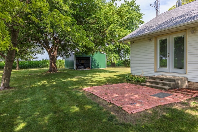22998 E 2800 N Rd, Odell, IL 60460 - view of grassy yard featuring an outbuilding and a patio area