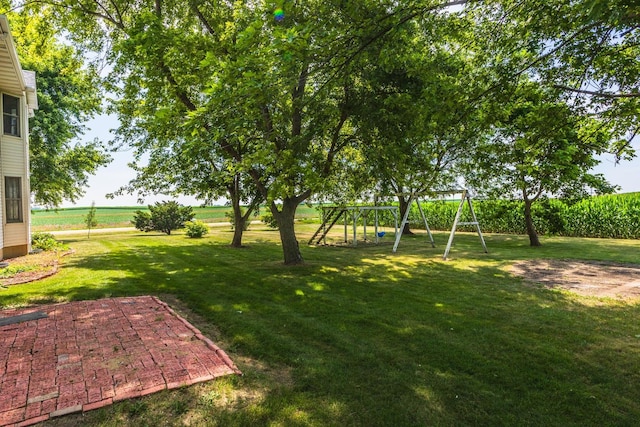 22998 E 2800 N Rd, Odell, IL 60460 - view of grassy yard with a playground and a patio area