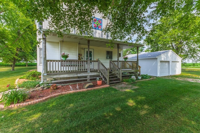 22998 E 2800 N Rd, Odell, IL 60460 - view of front of house with covered porch, an outbuilding, a front lawn, and a detached garage