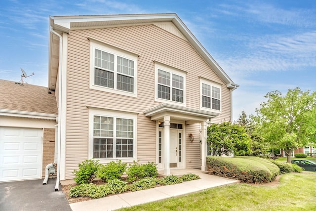 133 W Park Ave Unit A, Sugar Grove, IL 60554 - view of front of house featuring a front lawn and a garage