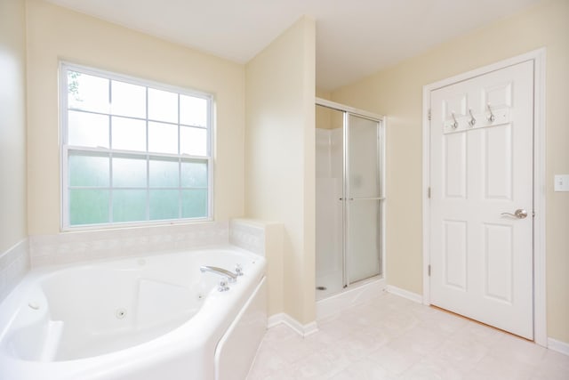 133 W Park Ave Unit A, Sugar Grove, IL 60554 - full bath featuring a tub with jets, a shower stall, and healthy amount of natural light