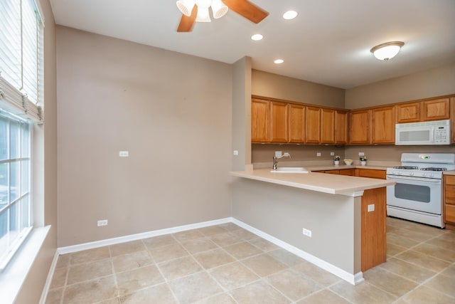 133 W Park Ave Unit A, Sugar Grove, IL 60554 - kitchen featuring white appliances, light countertops, a ceiling fan, a peninsula, and recessed lighting
