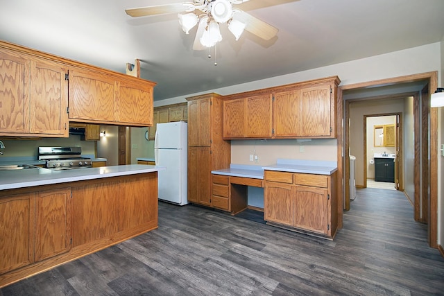 1177 N 6250w Rd, Bonfield, IL 60913 - kitchen with freestanding refrigerator, stainless steel gas range oven, a ceiling fan, dark wood-style floors, and built in desk