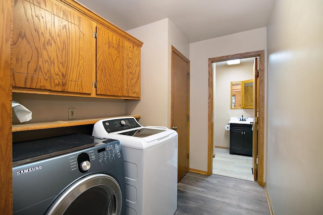 1177 N 6250w Rd, Bonfield, IL 60913 - laundry area with washer and dryer, light wood finished floors, and cabinet space