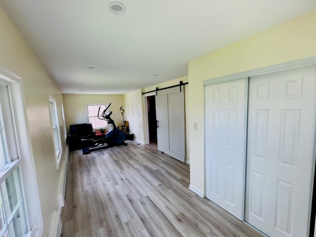 9321 S 81st Ct, Hickory Hills, IL 60457 - living area with a barn door and light wood-style flooring