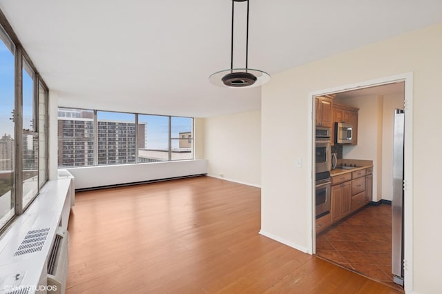 5757 N Sheridan Rd Unit 20J, Chicago, IL 60660 - empty room featuring wood finished floors and baseboards