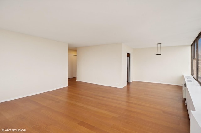 5757 N Sheridan Rd Unit 20J, Chicago, IL 60660 - unfurnished living room featuring light wood-style flooring