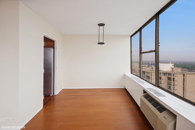 5757 N Sheridan Rd Unit 20J, Chicago, IL 60660 - unfurnished dining area featuring wood finished floors and baseboards