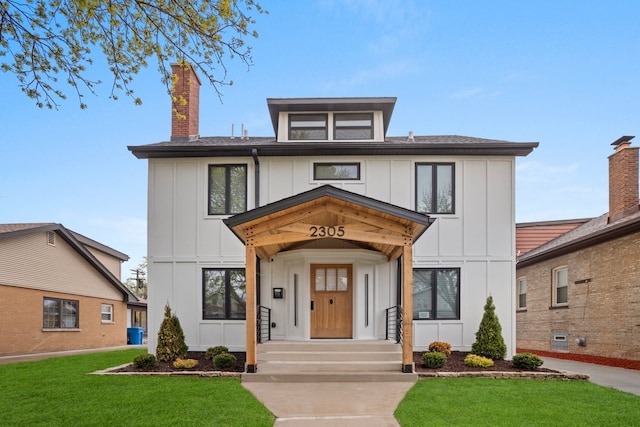 2305 W 111th Pl, Chicago, IL 60643 - view of front of home with board and batten siding, a front lawn, and a shingled roof