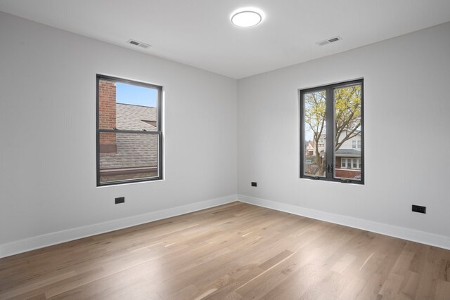 2305 W 111th Pl, Chicago, IL 60643 - unfurnished room with plenty of natural light and light wood finished floors