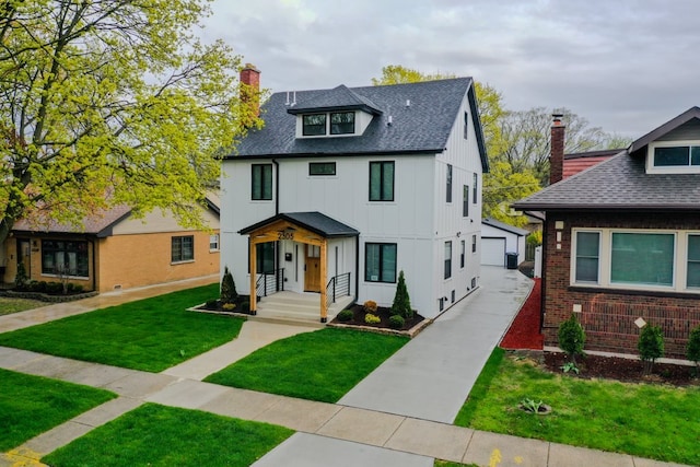 2305 W 111th Pl, Chicago, IL 60643 - view of front of property with a chimney, board and batten siding, an outdoor structure, a front yard, and a shingled roof