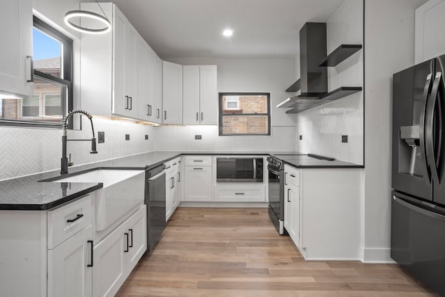 2305 W 111th Pl, Chicago, IL 60643 - kitchen featuring stainless steel appliances, light wood finished floors, tasteful backsplash, white cabinetry, and wall chimney exhaust hood