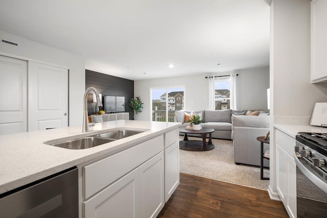 6335 Ulster Dr, Tinley Park, IL 60477 - kitchen with stainless steel appliances, open floor plan, dark wood-style floors, white cabinets, and light stone countertops
