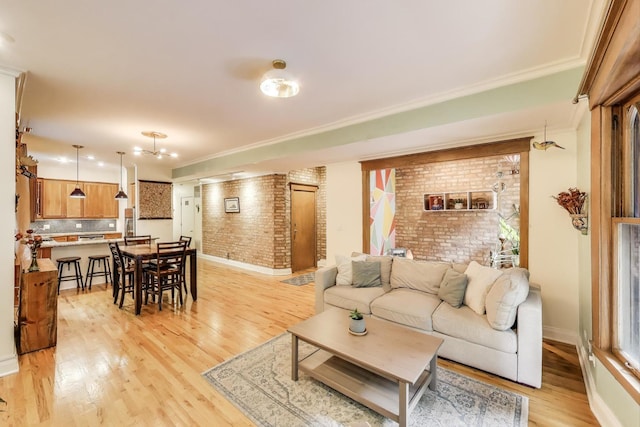 4611 N Magnolia Ave Unit 2, Chicago, IL 60640 - living room with brick wall, light wood finished floors, and crown molding