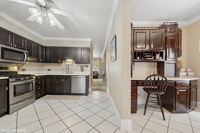 3432 S Union Ave, Chicago, IL 60616 - kitchen featuring stainless steel appliances, light tile patterned flooring, ornamental molding, light countertops, and ceiling fan