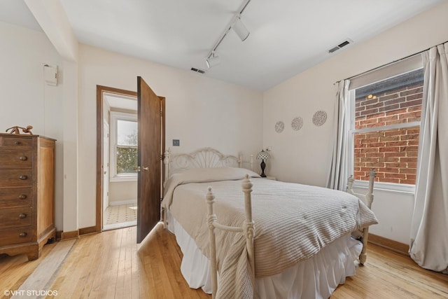 3432 S Union Ave, Chicago, IL 60616 - bedroom with light wood-style flooring and track lighting