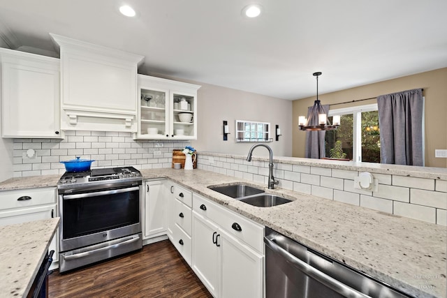 10750 Cape Cod Ln, Huntley, IL 60142 - kitchen featuring appliances with stainless steel finishes, backsplash, a chandelier, white cabinets, and recessed lighting
