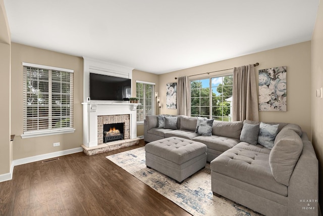 10750 Cape Cod Ln, Huntley, IL 60142 - living room featuring wood finished floors and a brick fireplace