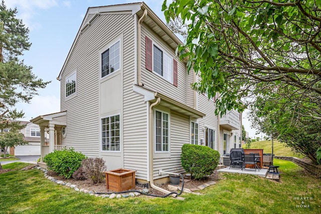 10750 Cape Cod Ln, Huntley, IL 60142 - view of side of home with a yard and a patio area