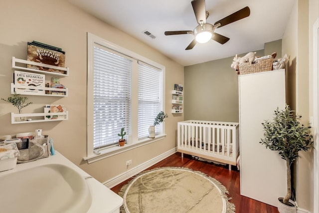 1918 W Cullom Ave Unit 202, Chicago, IL 60613 - bedroom with wood finished floors, ceiling fan, and a crib