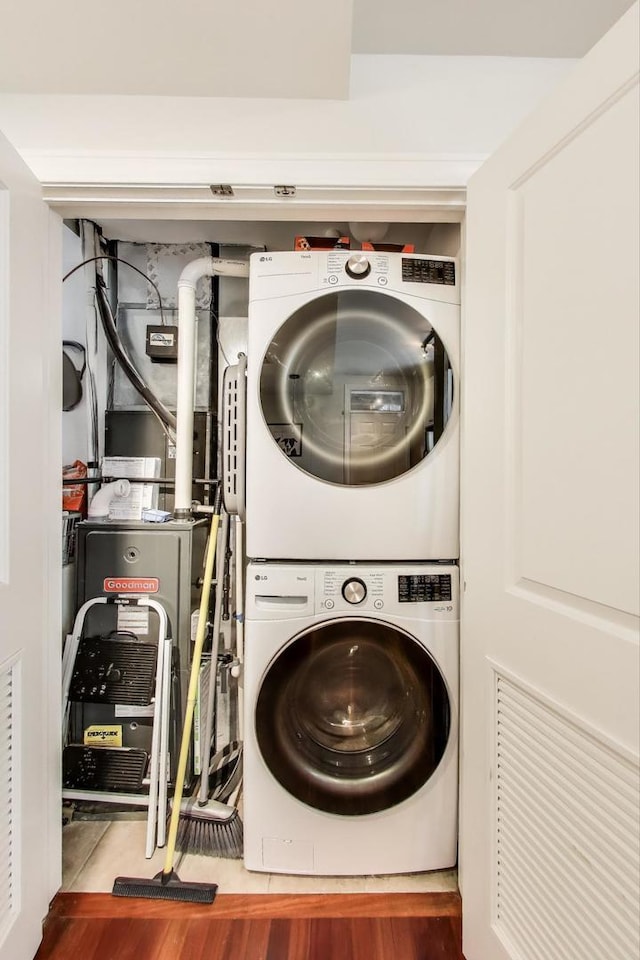 1918 W Cullom Ave Unit 202, Chicago, IL 60613 - washroom with stacked washer / drying machine and wood finished floors