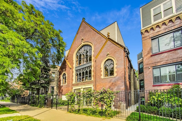 1847 N Kedzie Ave Unit 1N, Chicago, IL 60647 - view of front of property featuring a fenced front yard and brick siding