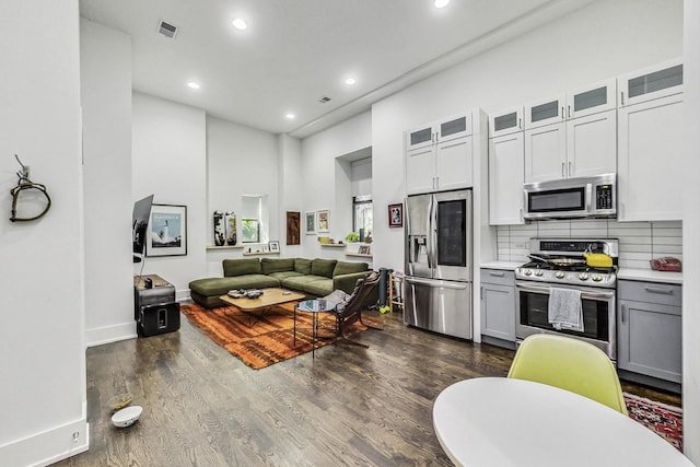 1847 N Kedzie Ave Unit 1N, Chicago, IL 60647 - living area featuring recessed lighting, a high ceiling, and dark wood-style floors