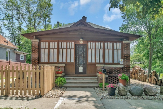 309 S 2nd Ave, Streator, IL 61364 - view of front facade featuring entry steps, a chimney, and brick siding