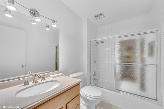4838 Howard St Unit 301, Skokie, IL 60077 - full bath featuring vanity, combined bath / shower with glass door, and tile patterned flooring