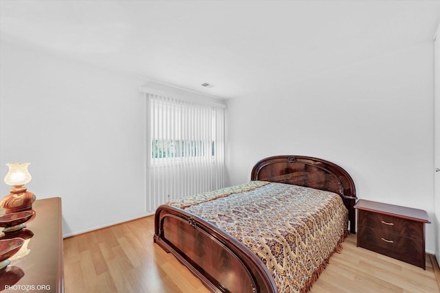 4838 Howard St Unit 301, Skokie, IL 60077 - bedroom featuring light wood-style flooring and baseboards