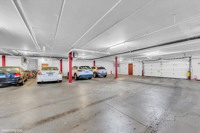 4838 Howard St Unit 301, Skokie, IL 60077 - parking deck featuring a garage door opener