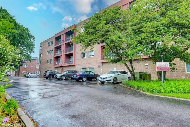4838 Howard St Unit 301, Skokie, IL 60077 - view of apartment building / complex with uncovered parking