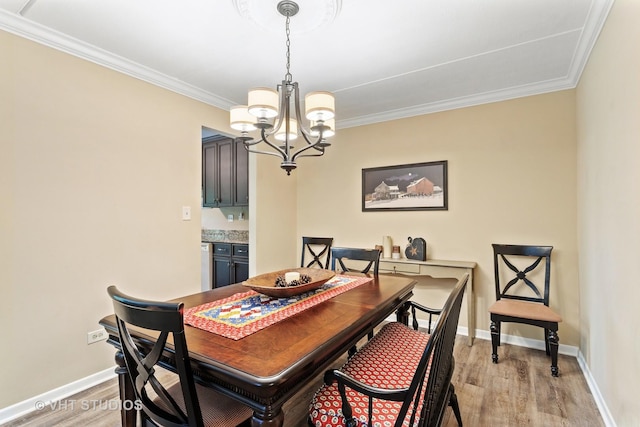 25 Algonquin Trl Unit 1, Indian Head Park, IL 60525 - dining area with a chandelier, light wood-type flooring, and crown molding