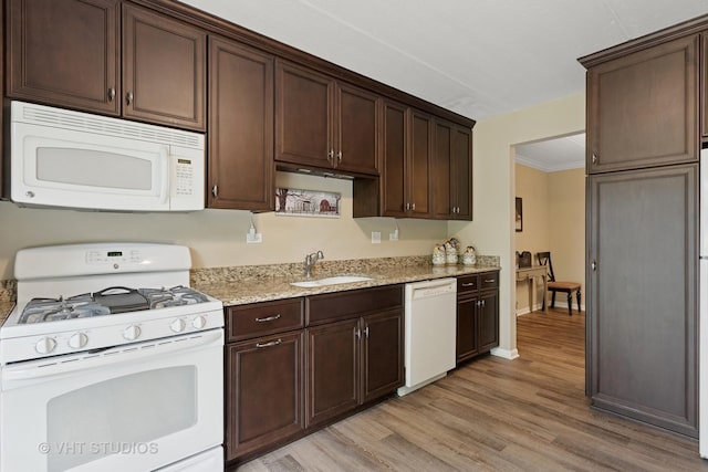 25 Algonquin Trl Unit 1, Indian Head Park, IL 60525 - kitchen with white appliances, light wood-style floors, dark brown cabinetry, light stone countertops, and ornamental molding