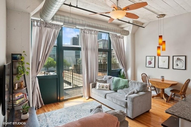 221 E Cullerton St Unit 314, Chicago, IL 60616 - living room with a ceiling fan and wood finished floors