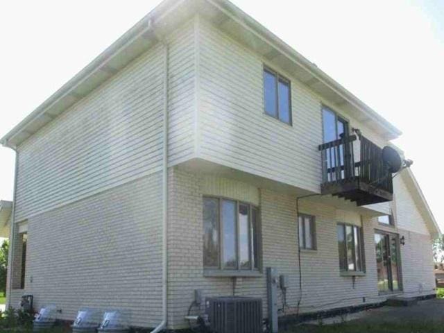 340 Maryview Ct, Matteson, IL 60443 - view of side of property featuring a balcony and brick siding