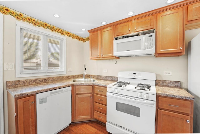 4153 W 89th Pl None, Unit None, Hometown, IL 60456 - kitchen with white appliances, wood finished floors, light countertops, recessed lighting, and brown cabinetry