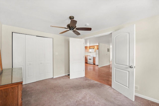 4153 W 89th Pl None, Unit None, Hometown, IL 60456 - unfurnished bedroom featuring light colored carpet, freestanding refrigerator, a closet, and ceiling fan