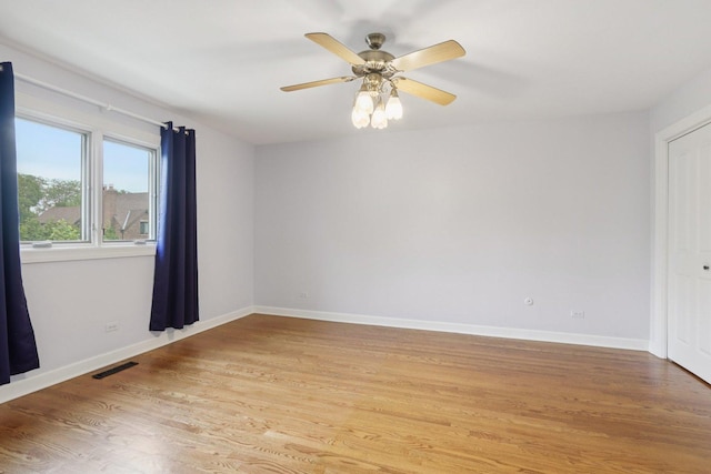 102 E Adelia St, Elmhurst, IL 60126 - empty room featuring light wood finished floors and a ceiling fan
