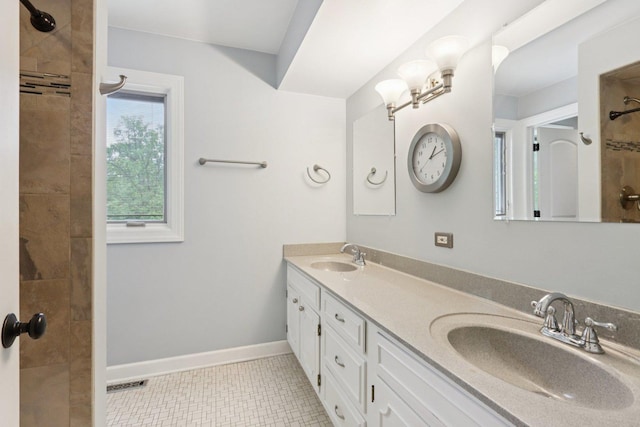 102 E Adelia St, Elmhurst, IL 60126 - full bathroom with double vanity, tiled shower, and tile patterned floors