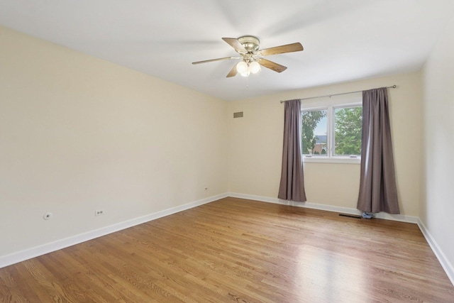 102 E Adelia St, Elmhurst, IL 60126 - empty room with light wood-style flooring and a ceiling fan