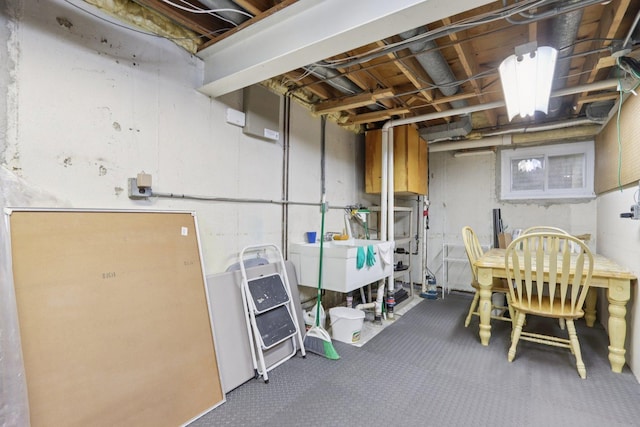 102 E Adelia St, Elmhurst, IL 60126 - unfinished below grade area with a sink and carpet flooring