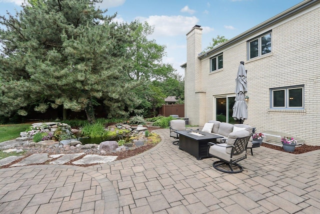 102 E Adelia St, Elmhurst, IL 60126 - view of patio with an outdoor living space with a fire pit
